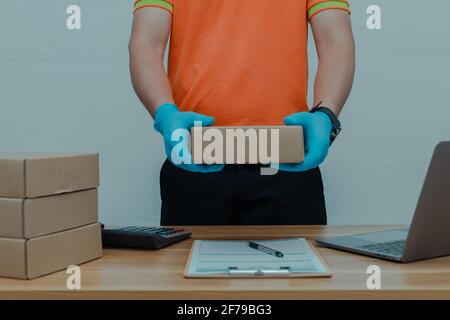A parcel delivery worker counting the parcel boxes Stock Photo