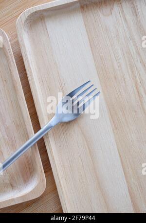 Wooden tray and fork Stock Photo