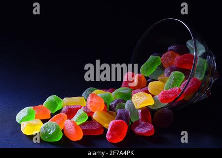 Gummy candies against dark background Stock Photo