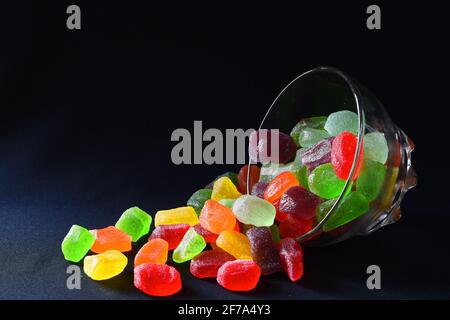 Gummy candies against dark background Stock Photo