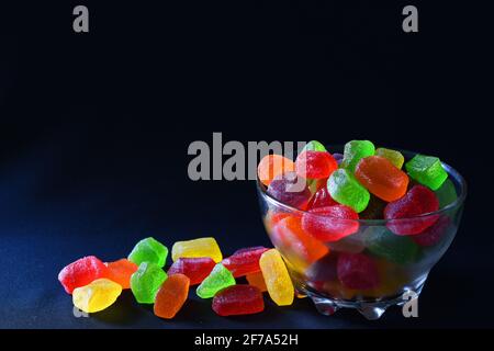 Gummy candies against dark background Stock Photo