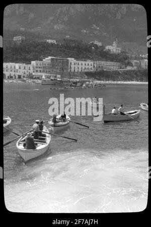 Skiopticon image from the Department of Photography at the Royal Institute of Technology. Motifus depicting rowing boats with tourists, probably in southern Italy. The picture is probably taken by John Hertzberg during a trip in Europe .. Stock Photo