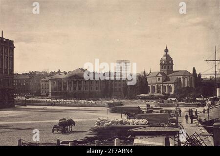 The telefon tower to Stokholm's general telephone share company telephone station Malmskillsgatan 30, in 1886. Printed image. Picture taken below the castle hills. The telephone tower in the fund. View from Skeppsbron.Här also visible the older opera house designed by Erik Palmstedt and was built in 1782.Hus Revs 1892 to be replaced by a more modern opera house. The image is from time 1887-1892. Stock Photo