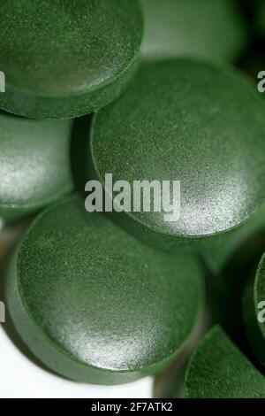 Green pills close up medical spirulina platensis algae family algaespace modern trendy food high quality big size print Stock Photo