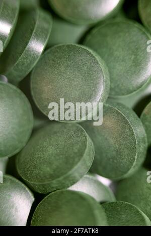 Green pills close up medical spirulina platensis algae family algaespace modern trendy food high quality big size print Stock Photo