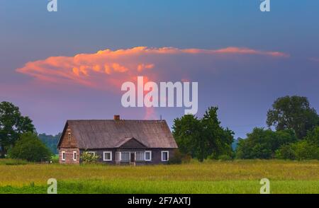 Storm tower clouds in the red evening sky Stock Photo