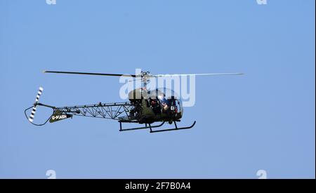 Bell 47G-4A G - MASH  Helicopter in flight Stock Photo