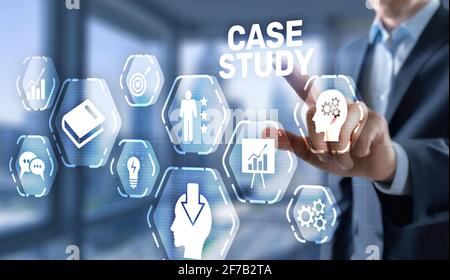 Businessman pressing case study button on virtual screens. Stock Photo