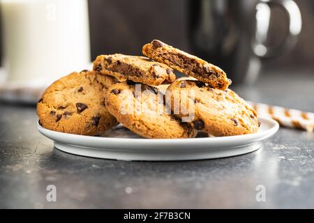 Tasty biscuits with chocolate. Sweet chocolate cookies on plate. Stock Photo