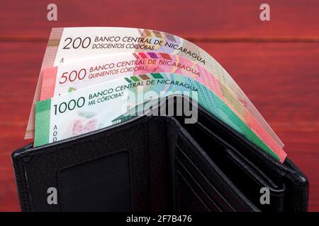 Nicaraguan cordoba in the black wallet Stock Photo