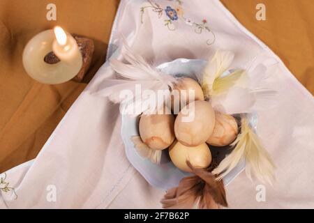 Easter eggs in bowl on table Stock Photo