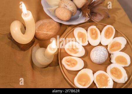 Halved boiled eggs on plate Stock Photo
