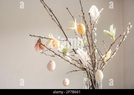 Twigs with hanging Easter eggs Stock Photo