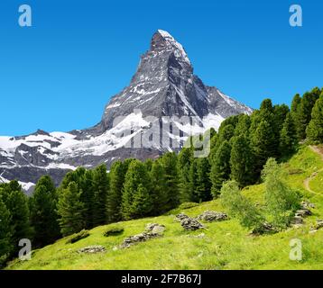 Beautiful mountain landscape with views of the Matterhorn peak in Pennine alps, Switzerland. Stock Photo