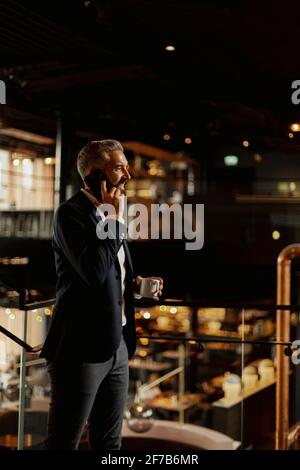 Businessman talking via cell phone Stock Photo