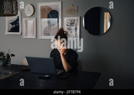 Woman working on laptop Stock Photo