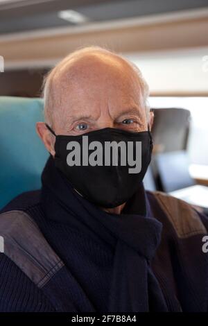Senior man traveling by train Stock Photo