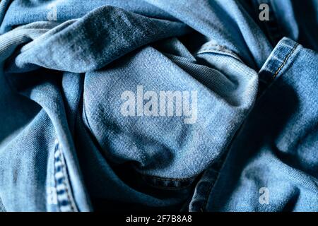 wrinkled blue denim jeans background Stock Photo