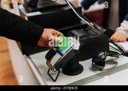 Woman paying with credit card in shop Stock Photo