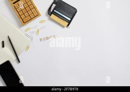 Wallet and calculator on desk Stock Photo