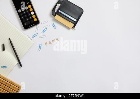 Wallet and calculator on desk Stock Photo