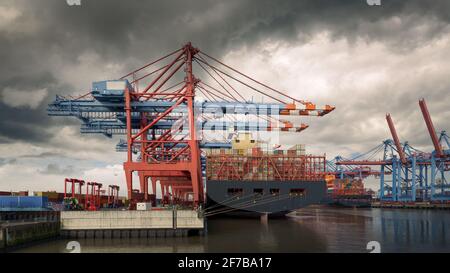 A large container ship at the terminal in the Port of Hamburg Stock Photo