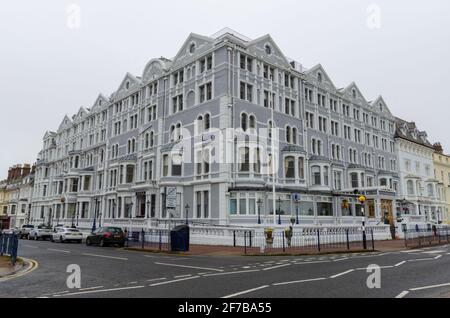 Llandudno, UK: Mar 18, 2021: The Imperial Hotel located on the promenade is part of Greenclose Hotels group At rear of the hotel, there is a Tesla Des Stock Photo