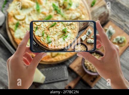 Pizza four cheeses on the table Stock Photo