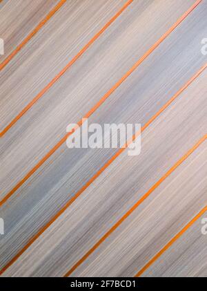 The modern pattern on the veneer wall with the orange strip of the coffee shop, front view for the background. Stock Photo