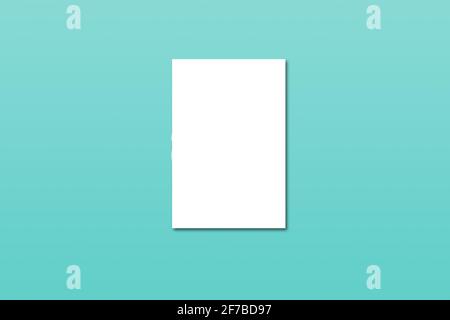 White empty blank card template mock up on green background. Flat lay, top view. Stock Photo
