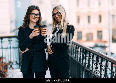 Smiling diverse employees chatting, discussing work during coffee break in office Stock Photo