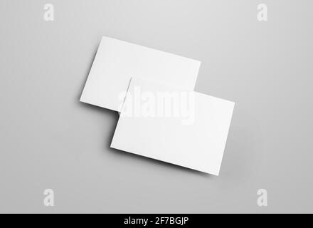 Business folding bifold template isolated on gray background, with realistic shadows. Mockup 2 paper brochures for presentation design. Closed blank b Stock Photo