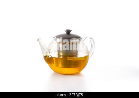 Teapot with ginger tea, lemon and honey isolated on white background Stock Photo