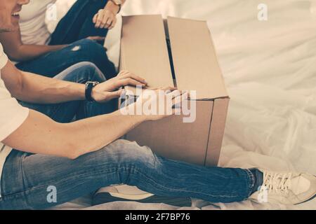 close up. couple opening a large cardboard box. Stock Photo
