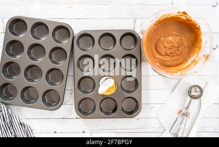 https://l450v.alamy.com/450v/2f7bpgy/flat-lay-cupcake-pan-lined-with-foil-cupcake-cups-to-bake-chocolate-raspberry-cupcakes-2f7bpgy.jpg