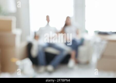 blur image of a young couple in their new apartment . Stock Photo