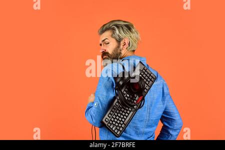 Hipster gamer headphones and keyboard. Shop gadgets. Gaming addiction. Superior performance. Graphics settings pushed to limit. Play computer games Stock Photo