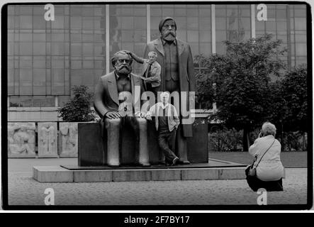 Berlin Statue of Marx and Engels 1994. Berlin. Marx-Engels-Forum is a public park in the central Mitte district of Berlin, the capital of Germany. It is named for Karl Marx and Friedrich Engels, authors of The Communist Manifesto of 1848 and regarded as two of the most influential people in the socialist movement. The park was created by the authorities of the former German Democratic Republic (GDR) in 1986 Stock Photo