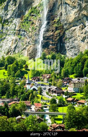 The church and the Staubbach Falls in Lauterbrunnen, Switzerland Stock Photo