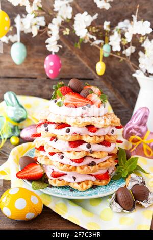 Waffles stacked with whipped cream and fresh strawberries Stock Photo
