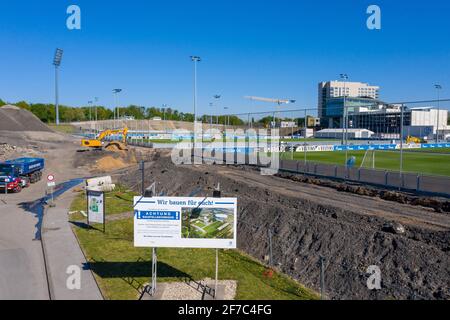 Gelsenkirchen, Deutschland. 22nd Apr, 2020. firo: 04/22/2020, football, 1st Bundesliga, 2019/2020 season, FC Schalke 04, construction project Berger Feld, modern training grounds, aerial view, from above, drone, drone photo, we will build a poster for you, construction work, the Park Stadium in the back | usage worldwide Credit: dpa/Alamy Live News Stock Photo