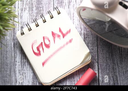 top view of new year goals text on notepad. Stock Photo