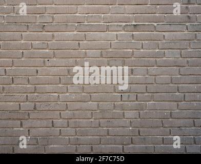 part of beige colored brick wall Stock Photo