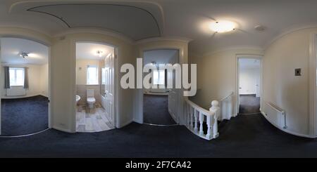 360 degree panoramic view of A 360 Degree Full Sphere Panoramic photo of a modern newly built house interior showing the stairs and hallway of the British newly built house