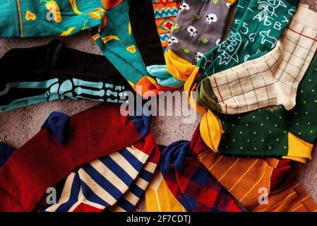 Colorful sock on grey background, top view. Knitted socks Stock Photo