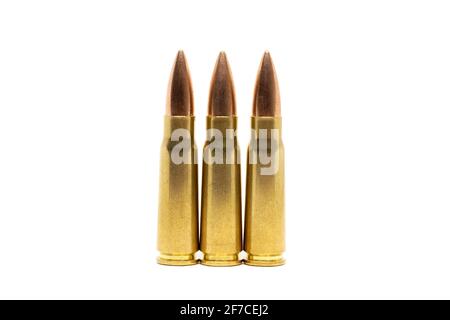 Three bullets isolated on white background. Cartridges 7.62 caliber for Kalashnikov assault rifle closeup Stock Photo