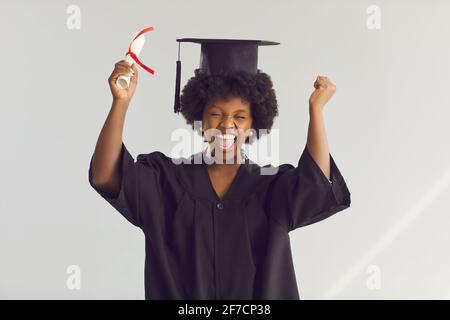 Back, education and black woman with graduation, celebration and success  with a diploma. Female person, graduate and girl with a degree, achievement  Stock Photo - Alamy