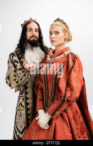 interracial king and queen in medieval clothing and crowns isolated on white Stock Photo