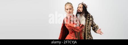 interracial king and queen in medieval clothing and crowns isolated on white, banner Stock Photo