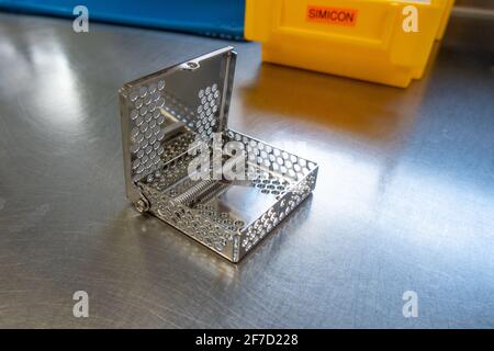 a simicon test for checking the cleaning performance of a washing machine in the operating room stands on a silver base Stock Photo